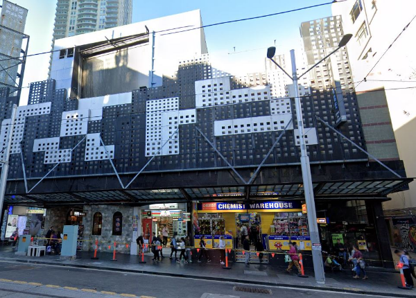 : City street scene with an overhead structure, indicating the location where Mechair Engineering Solutions performed an air conditioning plant upgrade and ductwork replacement