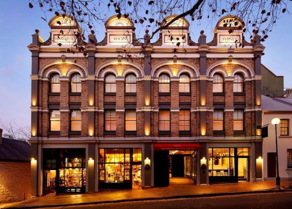 Historic brick facade hotel at dusk, highlighting upgrades by Mechair Engineering Solutions to its Daikin VRV air conditioning system for guest rooms