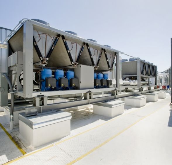 Industrial cooling tower equipment installed on a rooftop, showcasing Mechair Engineering Solutions' expertise in building services for Sydney's commercial sector